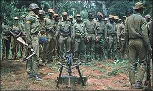 Biafran Ibo troops parade in a clearing circa 1968-9