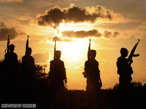 SLA troops patrol the front line in the Vanni